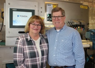 Rick and Marsha Gelowitz with Lucy the fruit sorter